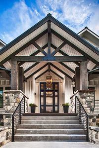 an entry way to a home with stone and wood