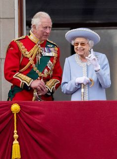 the queen and prince are standing next to each other