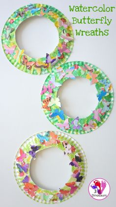 three paper plates with butterflies on them and the words, watercolor butterfly wreaths