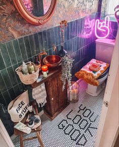 a bathroom with a sink, toilet and mirror