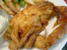 fried fish and fries on a plate with ranch dressing