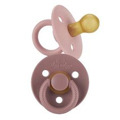 a pink pacifier with a wooden handle