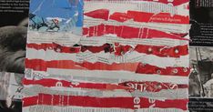 an american flag made out of newspaper strips