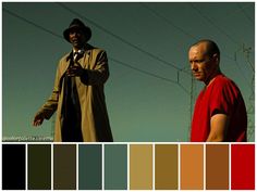 two men standing next to each other in front of power lines with color swatches