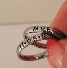 "These Stainless Steel rings are super shiny and a petite 3 mm wide, with a rounded edge. The letters y, p, and j do NOT do well on this rounded ring therefore I suggest if you have these letters in your name that you order the 3 mm flat ring available on my page. These rings are comfortable for stacking up to 4 rings. I can personalize with names, dates, quotes or roman numerals or scripture. Great to wear with your diamond or use as a thumb ring also. These rings also come in Gold and Rose Gol Dainty Adjustable Rings For Promise Occasion, Dainty Adjustable Ring For Promise, Adjustable Stackable Rings With Custom Name, Custom Name Adjustable Stackable Rings, Adjustable Stackable Initial Ring As Gift, Simple Stackable Midi Rings, Customizable Sterling Silver Initial Ring For Anniversary, Adjustable Dainty Initial Ring For Promise, Personalized Dainty Ring Jewelry