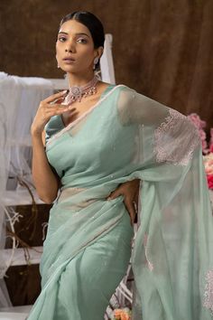 Mint green pure organza saree with floral placement embroidery and cutdana embroidered border. Paired with a blouse and petticoat. - Aza Fashions Bollywood Style Pista Green Organza Pre-draped Saree, Pista Green Organza Pre-draped Saree, Elegant Pista Green Organza Blouse Piece, Elegant Organza Blouse Piece In Pista Green, Designer Green Organza Saree, Elegant Green Saree With Chikankari Embroidery, Pista Green Organza Pre-draped Saree For Wedding, Elegant Green Pre-draped Saree With Chikankari Embroidery, Pista Green Organza Pre-draped Saree For Diwali