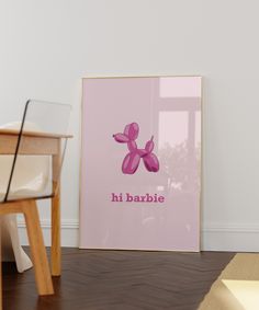 a pink poster with the words hi barbie on it next to a chair and table