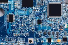 an electronic board with many different types of electronics on it's side, including cpus and chips