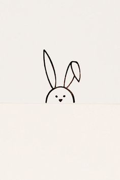 a drawing of a rabbit peeking out from behind a wall