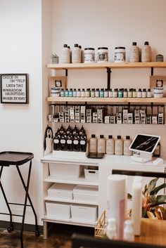 the inside of a beauty salon with lots of products on shelves