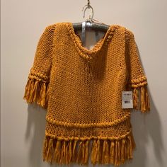 Mustard Colored Free People Sweater With 3” Fringe On Sleeves And Bottom Fall Knit Tops With Fringe, Knit Fringe Top For Fall, Knit Top With Fringe For Fall, Casual Knit Top With Fringe, One Size Fringe Tops For Spring, Spring Knit Top With Fringe, Wide Sleeve Top, Crochet Bell Sleeve, Free People Tank Top