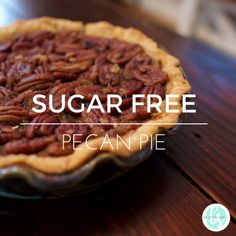 a pecan pie sitting on top of a wooden table with the words sugar free