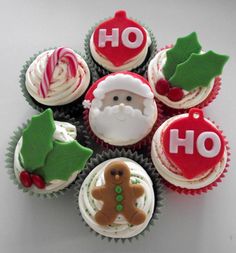 cupcakes decorated with icing and christmas decorations