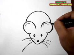 someone is drawing a cartoon mouse on paper