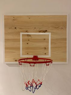 a basketball hoop mounted to the side of a wooden wall