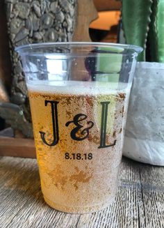 a beer glass sitting on top of a wooden table