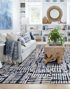 a living room with blue and white decor