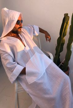 Men's caftan with hood White linen fabric small/medium/ large / XL / 2XL / 3XL / 4XL size options Linen robe for surfers Kangaroo pocket %100 linen V neck Feel free to ask for customization to visit my shop: www.etsy.com/shop/mnouss/ worldwide fast shipping Hooded Kaftan, Mens Kaftan, Kaftan For Men, Men Kaftan, Greece Fashion, Caftan Tunic, Designer Kurta, Linen Robe, Cotton Caftan