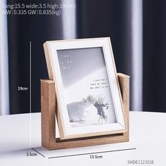 a wooden frame with a white flower in it