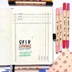 notebooks and pens are lined up next to each other