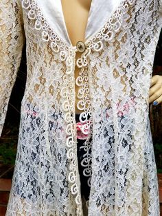 "Long LACE Cardigan in very nice condition. Tag LABEL SAM USA Small medium Measurements Shoulder to shoulder back 16\" Underarm to underarm back 21\" Measurement at button closure 18\" taken flat at front Approximately 34-35\" Shoulder to hem 35\" plus tassel. Thanks for browsing through our shop, have an awesome day" Fitted Long Sleeve Cardigan For Festival, Vintage Fitted Summer Cardigan, Fitted Vintage Summer Cardigan, Fitted Vintage Cardigan For Spring, Fitted Long Cardigan For Festivals, Fitted White Outerwear For Festival, Fitted Vintage Outerwear For Festival, Vintage Fall Festival Cardigan, Long Lace Cardigan