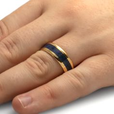 Something blue for your wedding ring or as a beautiful, everyday accessory! This lapis lazuli ring is crafted in solid 14k yellow gold Genuine lapis is inlaid in polished gold perfection. A wonderful blue men's wedding band choice. RING LAYOUT Ring Width: 8 mmRing Sleeve: 14k Yellow GoldRing Profile: BeveledRing Finish: Polished 2 mm 14k Yellow Gold4 mm Lapis Lazuli2 mm 14k Yellow Gold Handmade Lapis Lazuli Yellow Gold Jewelry, Luxury Lapis Lazuli Rings For Gift, Polished Yellow Gold Lapis Lazuli Jewelry, Classic Blue Lapis Lazuli Rings, Yellow Gold Lapis Lazuli Ring With Polished Finish, Mens Gold Wedding Band, Lapis Lazuli Jewelry, Lapis Lazuli Ring, Everyday Accessories