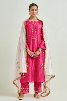 Fuchsia straight kurta with heavy floral pattern embroidery. Comes with embroidered hem pant and light pink embroidered dupatta.
Components: 3
Pattern: Embroidered
Type Of Work: Sequins, Cutdana and Gota Lace, Floral Patterns
Neckline: Round
Sleeve Type: Three Quarter
Fabric: Silk Chanderi
Color: Fuchsia
Other Details: 
Elasticated pant waistband
Fringed hem dupatta
Closure: Kurta: Front placket
Occasion: Puja - Aza Fashions Pant Saree, Kurta Pant Set, Embroidered Hem, Set Saree, Pant Set For Women, Embroidered Dupatta, Straight Kurta, Salwar Kameez Designs, Sharara Set