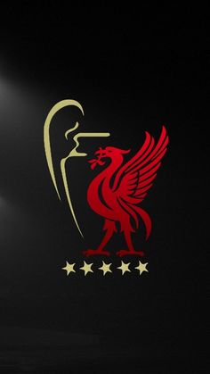 the liverpool united logo is lit up in the dark with three stars on each side