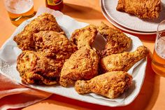 fried chicken and beer are on the table