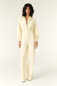 - Jumpsuit- Long sleeves fitted at the cuffs- Super comfortable elasticated waist- Shirt collar- Gathered waist- Chest pocket- Buttoned front- Clamp at the top of the back for total freedom of movement Pleated trousers inspiration- Side waist pockets Fitted Pantsuit With Belted Cuffs For Spring, Fitted Jumpsuits And Rompers With Elastic Waistband For Work, Relaxed Fit Jumpsuits With Elastic Waistband For Work, Khaki Military Style Long Sleeve Jumpsuits, Chic Yellow V-neck Jumpsuit, Fitted Jumpsuit With Button Closure And V-neck, Fitted V-neck Jumpsuit With Button Closure, Fitted Button-up Utility Jumpsuit/romper, Denim Sweatshirt