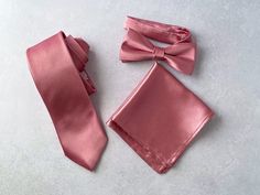 "We proudly present our solid dusty rose satin tie collection. -Hand-sewn semi skinny Adult Neck Tie -Pre-tied Bow tie available from Newborn up-to Adult size with adjustable strap. (Bow tie stitched into place) -Pocket square. Material: Satin, 100% Wool interlining for necktie Measurements: The necktie is appx. 56\" or 142 cm in length or longer if requested. The widest part measures 2 3/4\" or 7 cm Pocket square measure approximately 10\" squares. Our experienced team has over 100 years worth Solid Color Wedding Tie With Satin Bow, Solid Wedding Tie With Satin Bow, Wedding Satin Ties With Satin Finish, Wedding Ties With Satin Finish, Satin Wedding Ties, Satin Suit And Tie Accessories For Wedding, Wedding Satin Standard Tie, Pink Standard Tie For Groom, Pink Standard Tie Suit Accessories For Groom