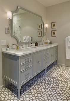 a bathroom with two sinks and mirrors in it