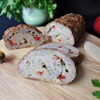 sliced up meatloaf on a cutting board with parsley