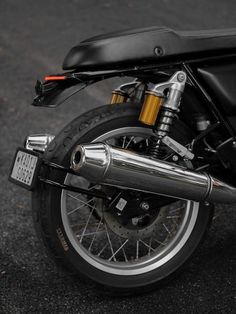 a close up of a motorcycle parked on the street