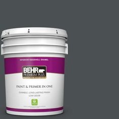 the behr paint and primer in one is shown on a green background with white trim