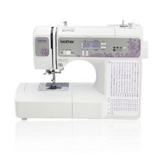 the brother sewing machine is white and has purple designs on it's front side