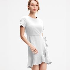 A minimalist and casual style, this piece is structured with a simple bodice shaped like a t-shirt and a frilled skirt. The look can remain simple with a pair of sneakers or can be paired with tights, boots and a biker jacket. Main material: 95% polyester, 5% elastane. Washing temperature 30 ° maximum in delicate cycle. Low ironing temperature / prohibited whitening. Do not dry in drum. White Fitted Ruffle Dress With Short Sleeves, Fitted White Ruffle Dress With Short Sleeves, Fitted Solid Color Ruffle Dress With Ruffle Hem, Fitted Ruffle Dress With Solid Color And Ruffle Hem, Solid Fitted Ruffle Dress For Spring, Fitted Ruffle Dress With Ruffle Hem, Elegant Short Sleeve Mini Dress With Ruffled Skirt, White Ruffle Dress With Short Sleeves, Short Skater Dress