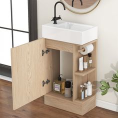 a bathroom sink sitting under a mirror next to a wall mounted faucet and wooden cabinet