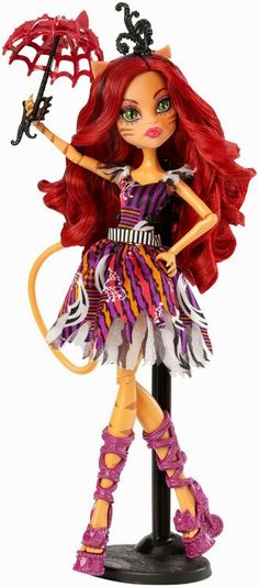 a doll with red hair holding an umbrella and standing on a black stand, wearing a purple dress