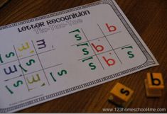 a close up of a letter recognition game on a table