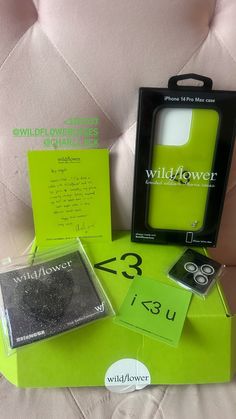 the packaging for wildflower's new cell phone is displayed on top of a green box