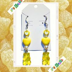 sweet as sugar, these cute gummy bear earrings are set in a glowing dandelion yellow shade with nickel-free hooks! Handmade! Neon Yellow Drop Earrings As A Gift, Playful Yellow Dangle Earrings, Cute Yellow Resin Jewelry, Playful Yellow Hypoallergenic Earrings, Playful Hypoallergenic Yellow Earrings, Cute Nickel-free Yellow Earrings, Cute Yellow Nickel-free Earrings, Novelty Yellow Earrings With Ear Wire, Yellow Novelty Earrings With Ear Wire