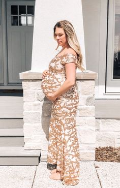 A solid maternity photoshoot gown featuring an off shoulder elastic neckline with a wrap front style, a mermaid style skirt with form-fitting ruched sides, cinching under the bust, and a hi-low hemline with a slight train. Photoshoot Gown, Shoulder Wrap, Mermaid Style, Maternity Photoshoot, Style Skirt, Gown Dress, Mermaid Fashion, A Mermaid, Gold Sequin