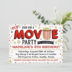 a movie birthday party with popcorn and stars on the front, in red and yellow