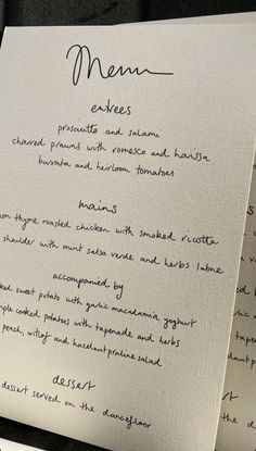 the menu is written in cursive writing on white paper