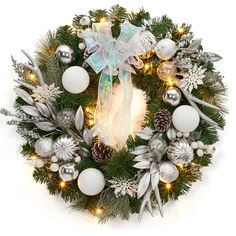 a christmas wreath with ornaments and lights