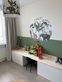 a child's playroom with toys and decor on the wall, along with an animal themed lamp shade