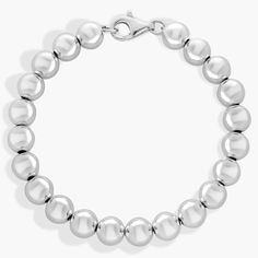 Make this sterling silver bead bracelet your silver lining. With its lightweight, 8mm-diameter, hollow silver beads strung along a flexible silver chain this bracelet adds luxe shine to your look whether worn alone or layered with other bracelets. Keep in mind that the bracelet fits about 1/4-inch smaller than the listed length to account for the thickness of the beads. White Gold Polished Beads Bracelet, Modern Silver Bracelets With Round Beads, Modern Silver Bracelet With Round Beads, Classic Sterling Silver Jewelry With Round Beads, Classic White Gold Ball Chain Jewelry, Classic Beaded Bracelets With Silver Beads, Classic Silver Beaded Round Bracelets, Classic Sterling Silver Bracelet With 8mm Beads Gift, Classic Sterling Silver Bracelet With Spacer Beads