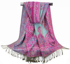 "Reversible paisley print jacquard pashmina scarves in beautiful shades of turquoise blue and hot pink. A traditional yet subtle combination of colors to complement multiple outfits in any wardrobe. Classy enough to be used formally yet cozy and soft for everyday use. Drapes freely and easy to carry. Great for weddings, rave, meditation, church, prayer and many more.You will not be disappointed with this versatile piece of garment. ~~Item details~~ Quantity: 1 rectangular long scarf Material: 55% Acrylic, 45% Viscose Length: approx. 73.5 inches Width: approx. 27.25 inches Fringes: 3\" on both ends ~~Care Instructions~~ Machine wash with similar colors Iron at low - medium setting Better to dry flat but can be dried in dryer Do not bleach Keep away from heat ~~Shipping Policy~~ We ship on s Pashmina Scarves, Wedding Scarf, Multiple Outfits, Scarf Material, Shades Of Turquoise, Pashmina Scarf, Long Scarf, Shawls And Wraps, Turquoise Blue