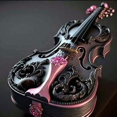 an artistically designed violin on a black surface